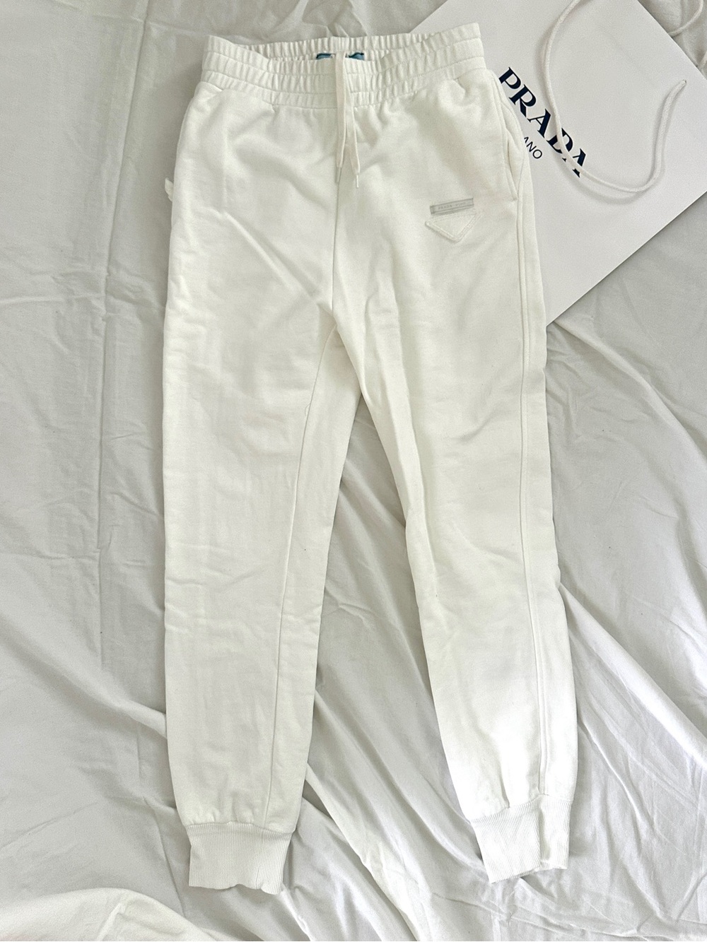 Prada triangle-logo sweatpants in white Size S